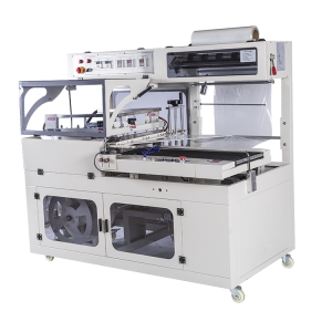 Sealing and cutting shrink packaging machine